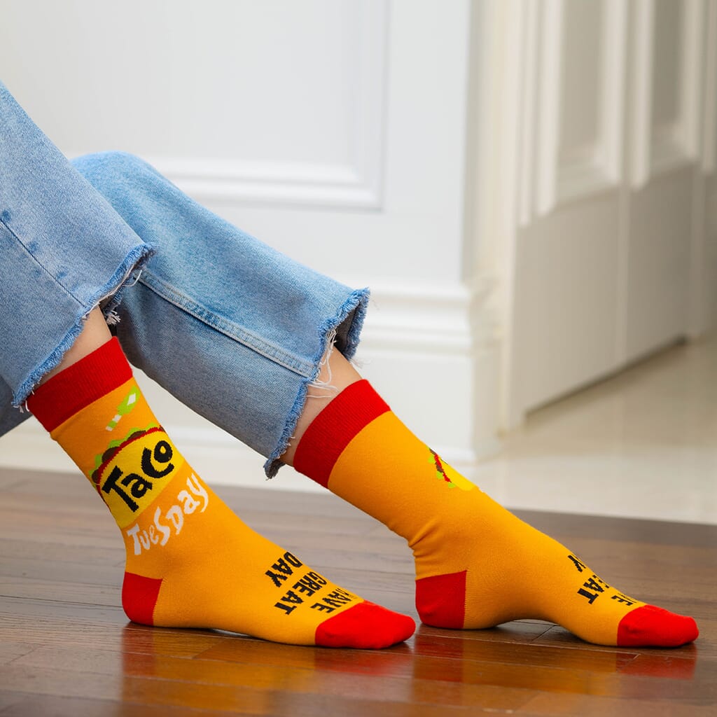 Lifestyle photo of patterned socks on a model